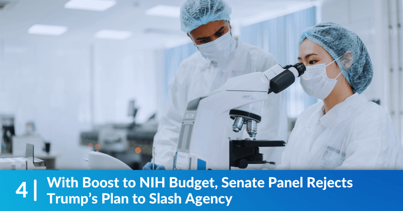 Epidemiologists looking through a microscope. Heading reads, "With Boost to NIH Budget, Senate Panel Rejects Trump’s Plan to Slash Agency".