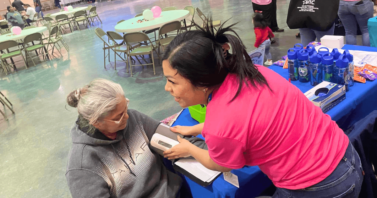 Patient being providing with a blood pressure test.